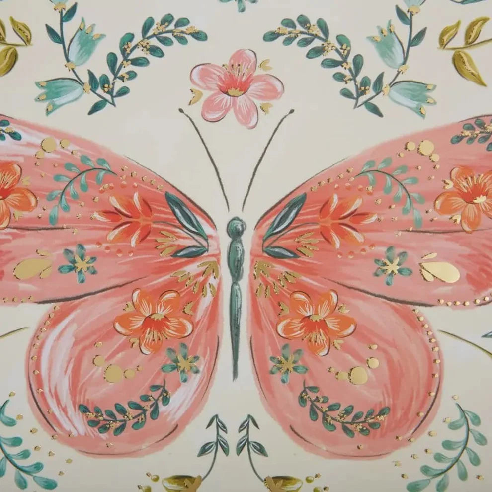 close-up of notebook with Butterfly and floral patterns on a light background