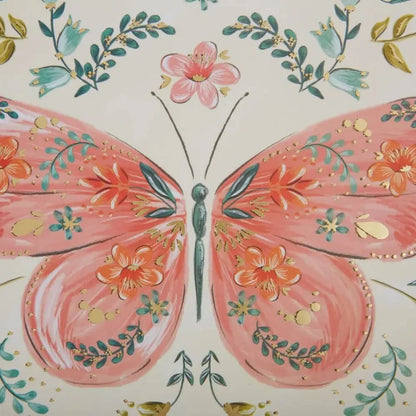 close-up of notebook with Butterfly and floral patterns on a light background
