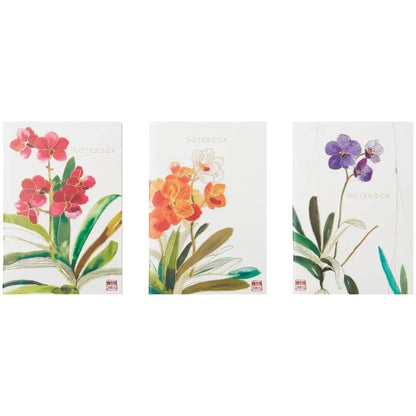 Three floral notebooks with different orchid designs on a white background