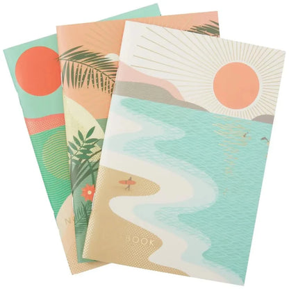 Set of three notebooks with beach-themed covers on a white background
