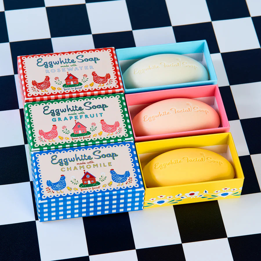 Three assorted boxes of soap partially open, showing bars inside.