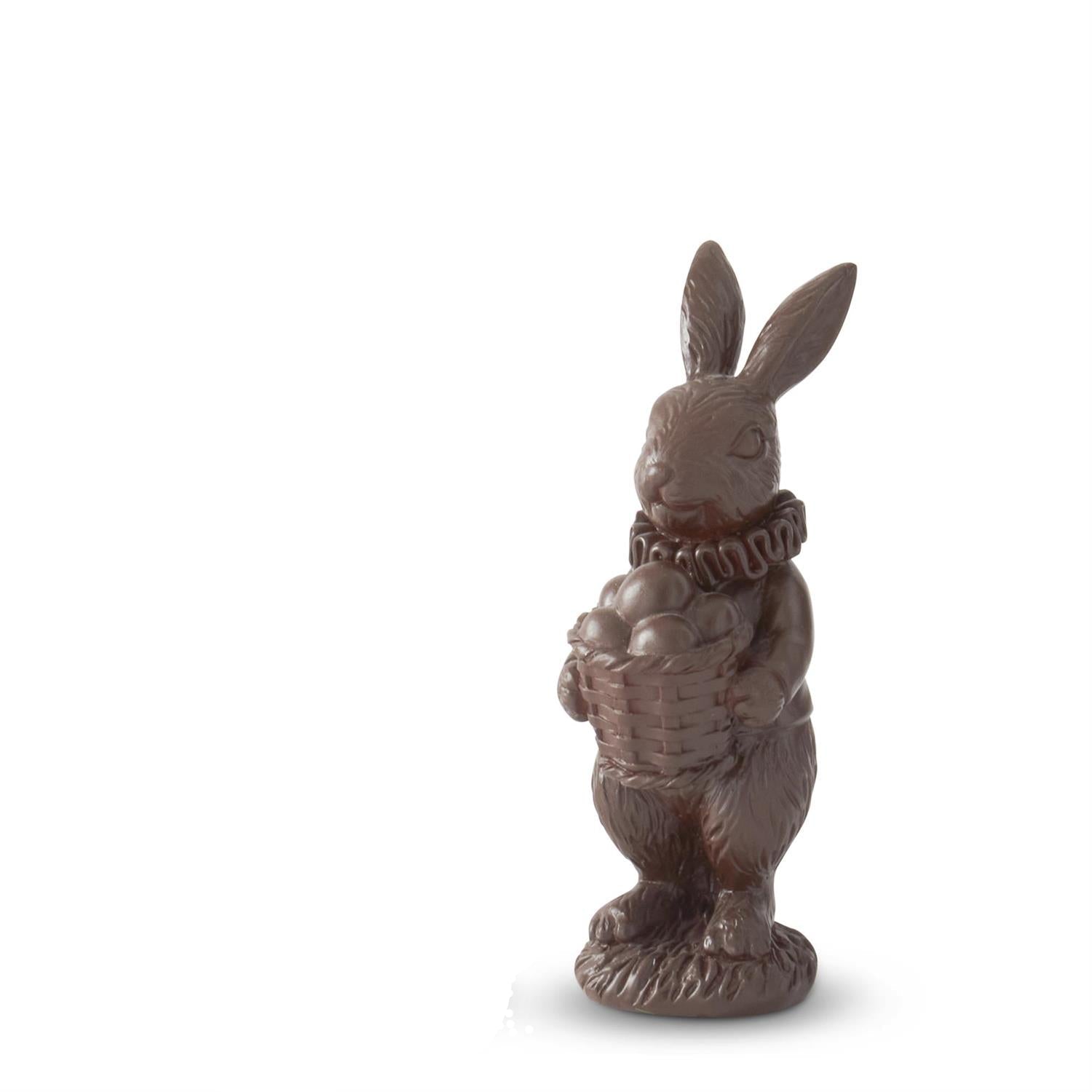 Decorative figurine of a rabbit holding a basket of eggs on a white background