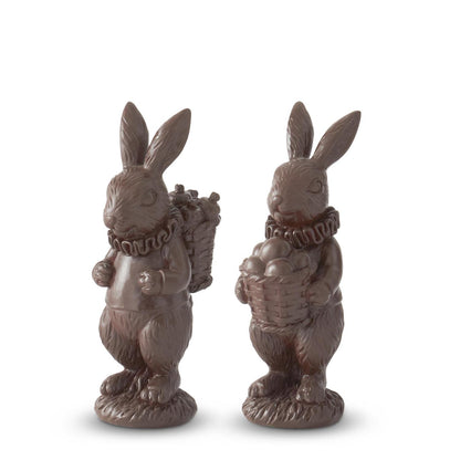 2 bunny figurines that look like chocolate candy bunnies carrying baskets 