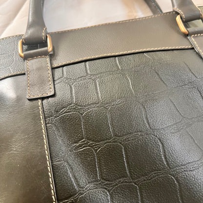 close-up of back of emilia briefcase.