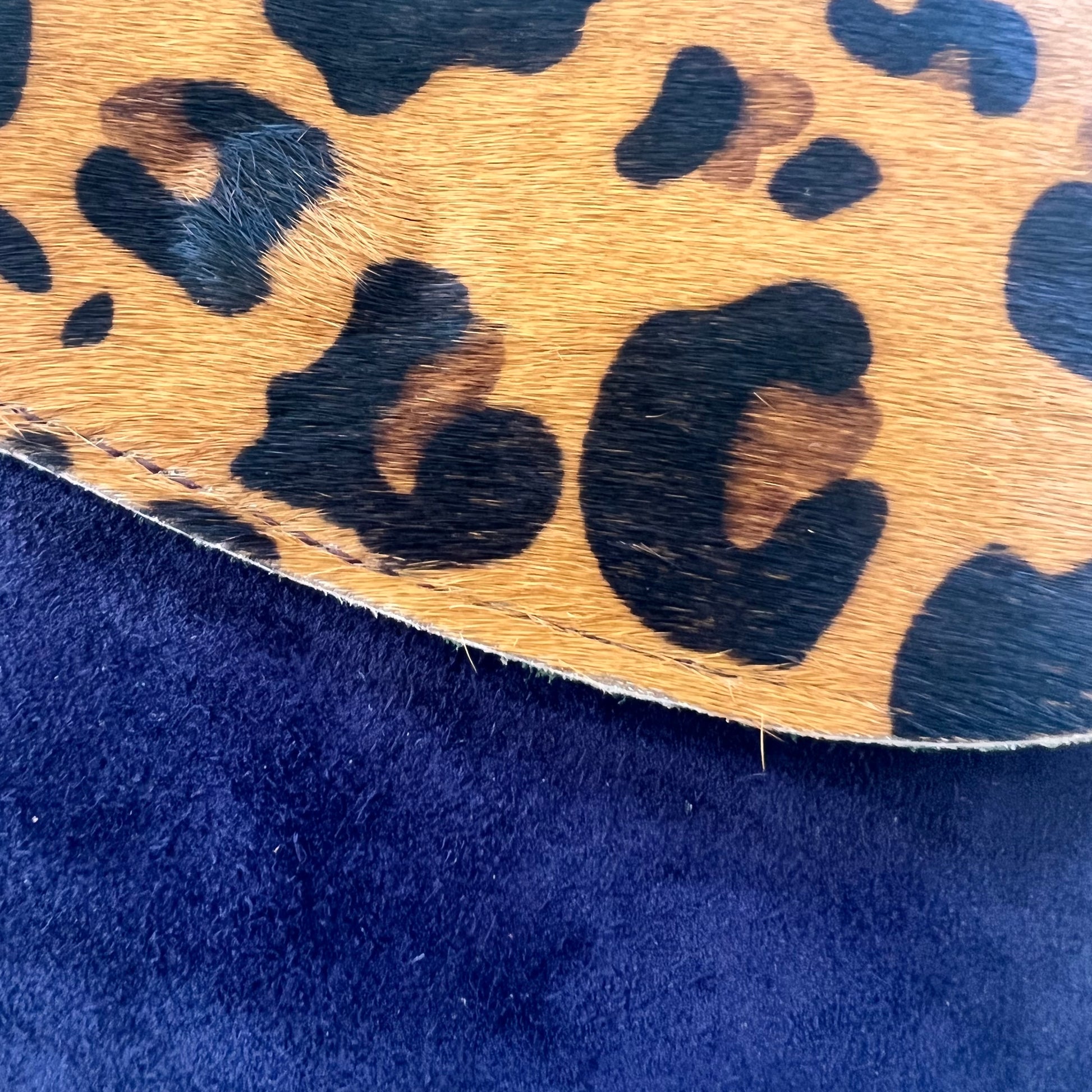 close-up on navy leo purse.