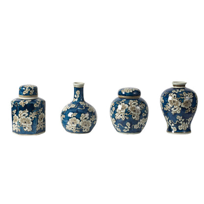 4 blue and white vases in a row against a white background