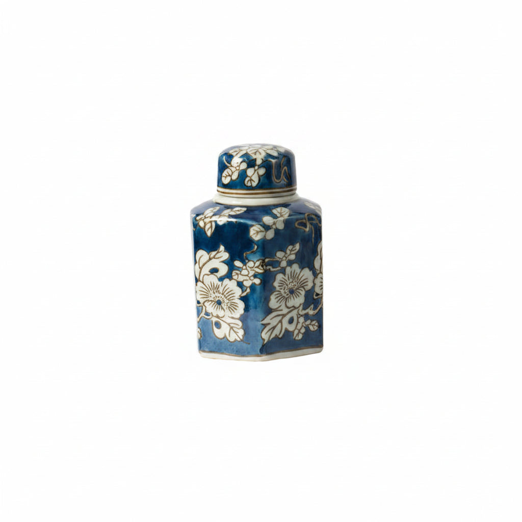 blue and white lidded vase on a white background
