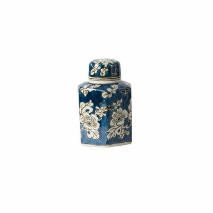 blue and white lidded vase on a white background