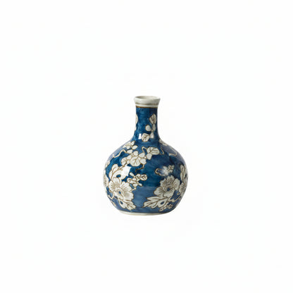 blue and white long neck vase on a white background