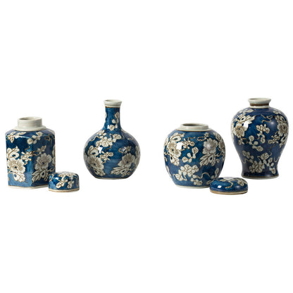 4 blue and white vases in a row against a white background,  the jar vases have their lids off