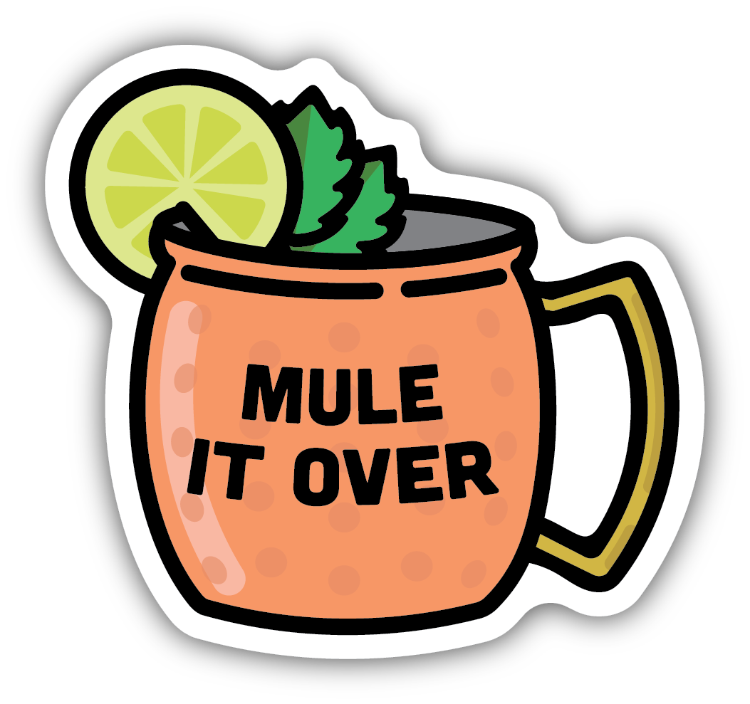 copper mug with text "mule it over" in the middle of the mug. A slice of lime and sprig of mint are on the rim of mug
