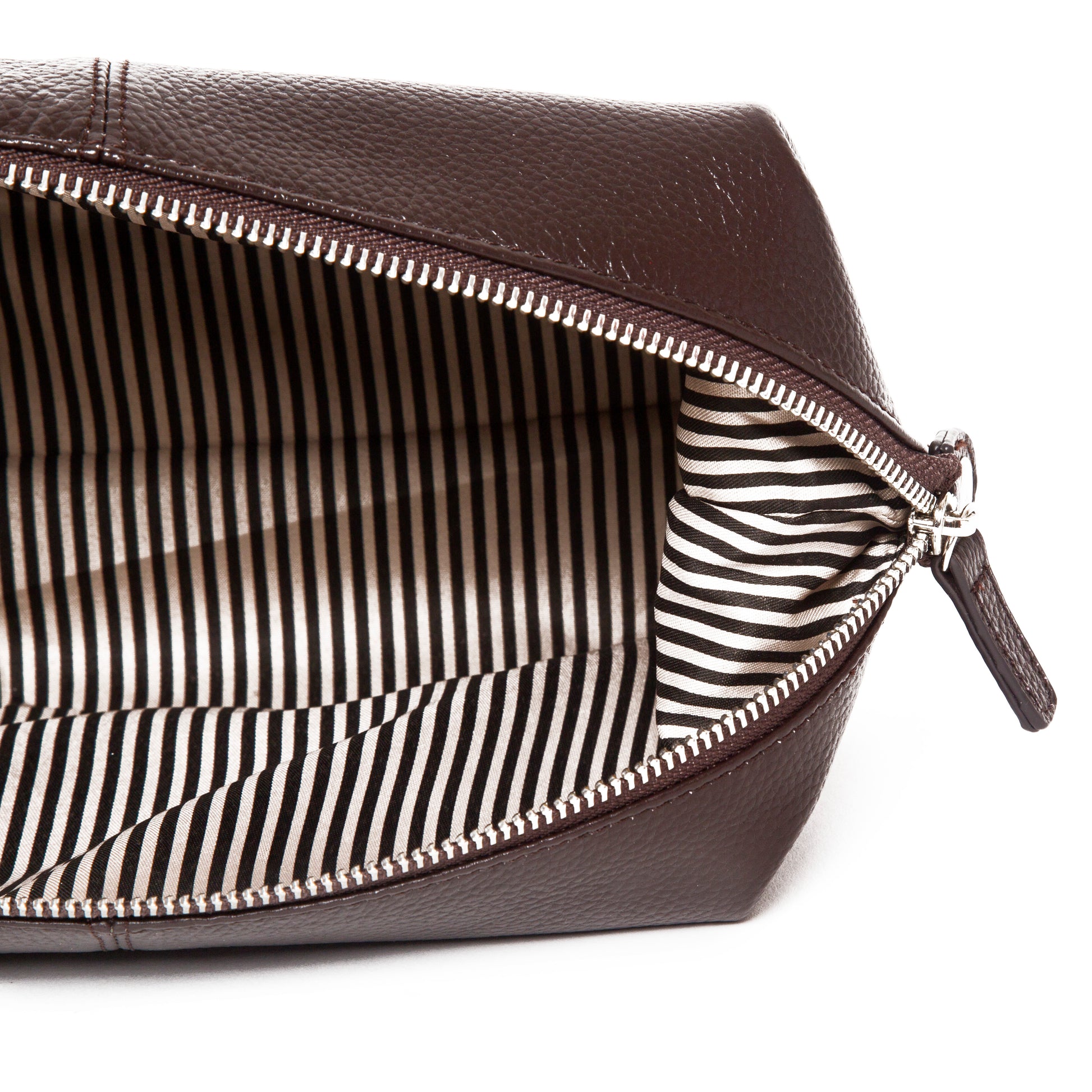 top down view of the stanford toiletry bag in brown showing the stripe interior