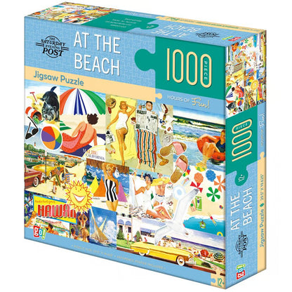 angled view of the Saturday Night Post 'At the Beach' 1000-piece jigsaw puzzle box, featuring a vibrant collage of retro beach scenes with people, umbrellas, cars, and palm trees.