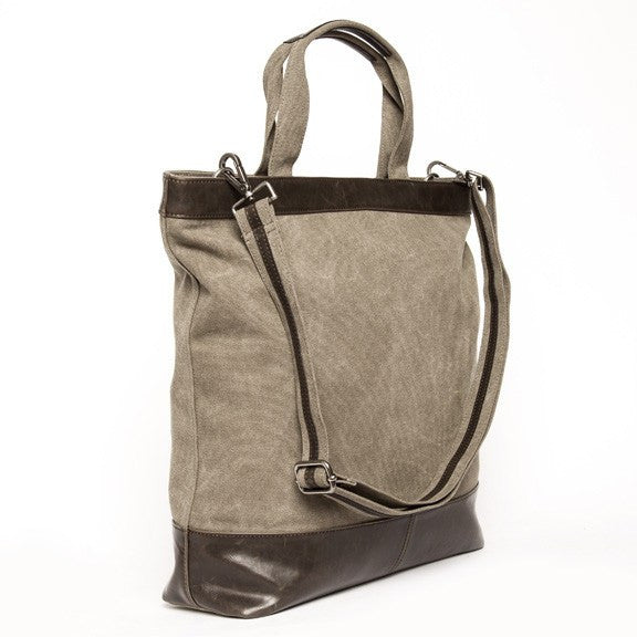 side  view of khaki canvas tote with vegan leather accents.
