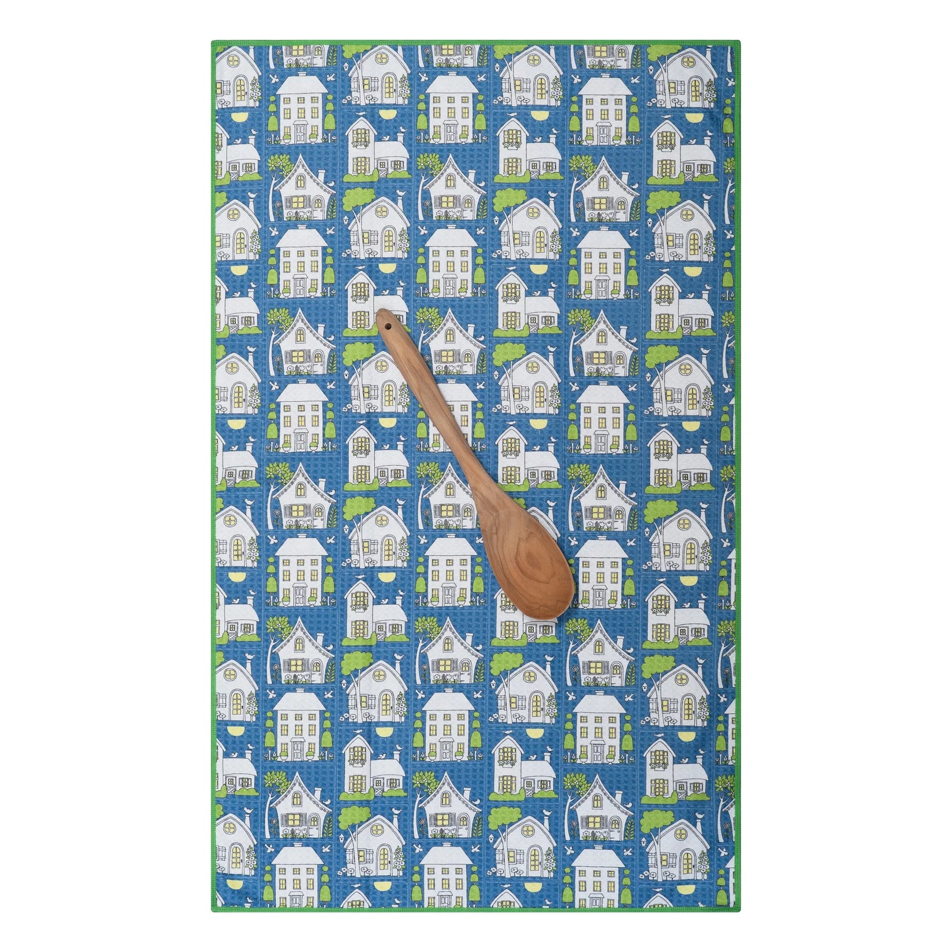 Twilight Cottages towel laying flat with wooden spoon on it