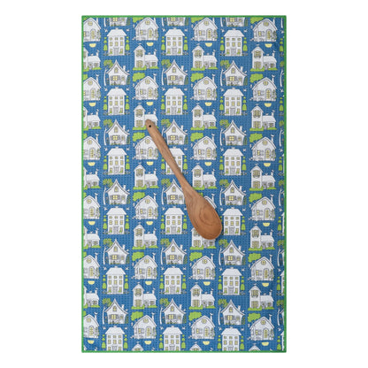 Twilight Cottages towel laying flat with wooden spoon on it