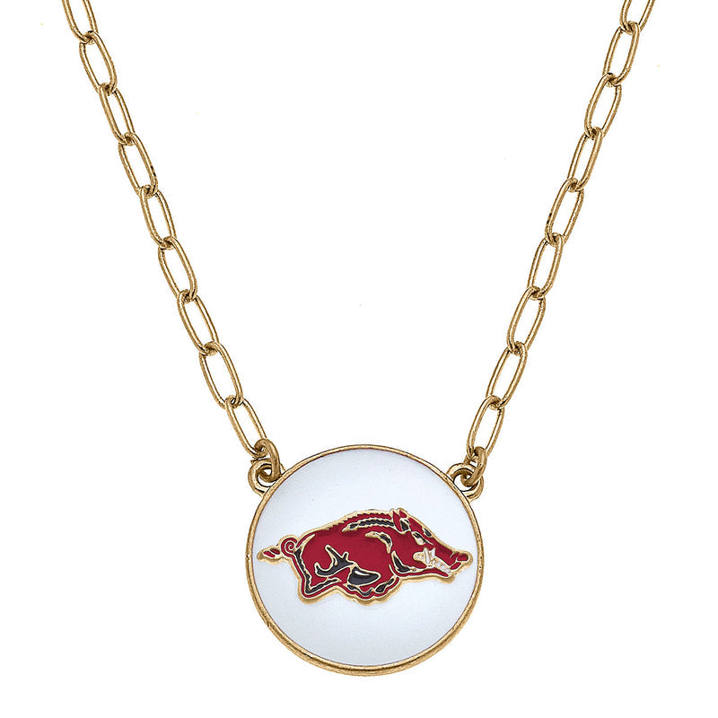 gold chain with razorback pendant disc on it.