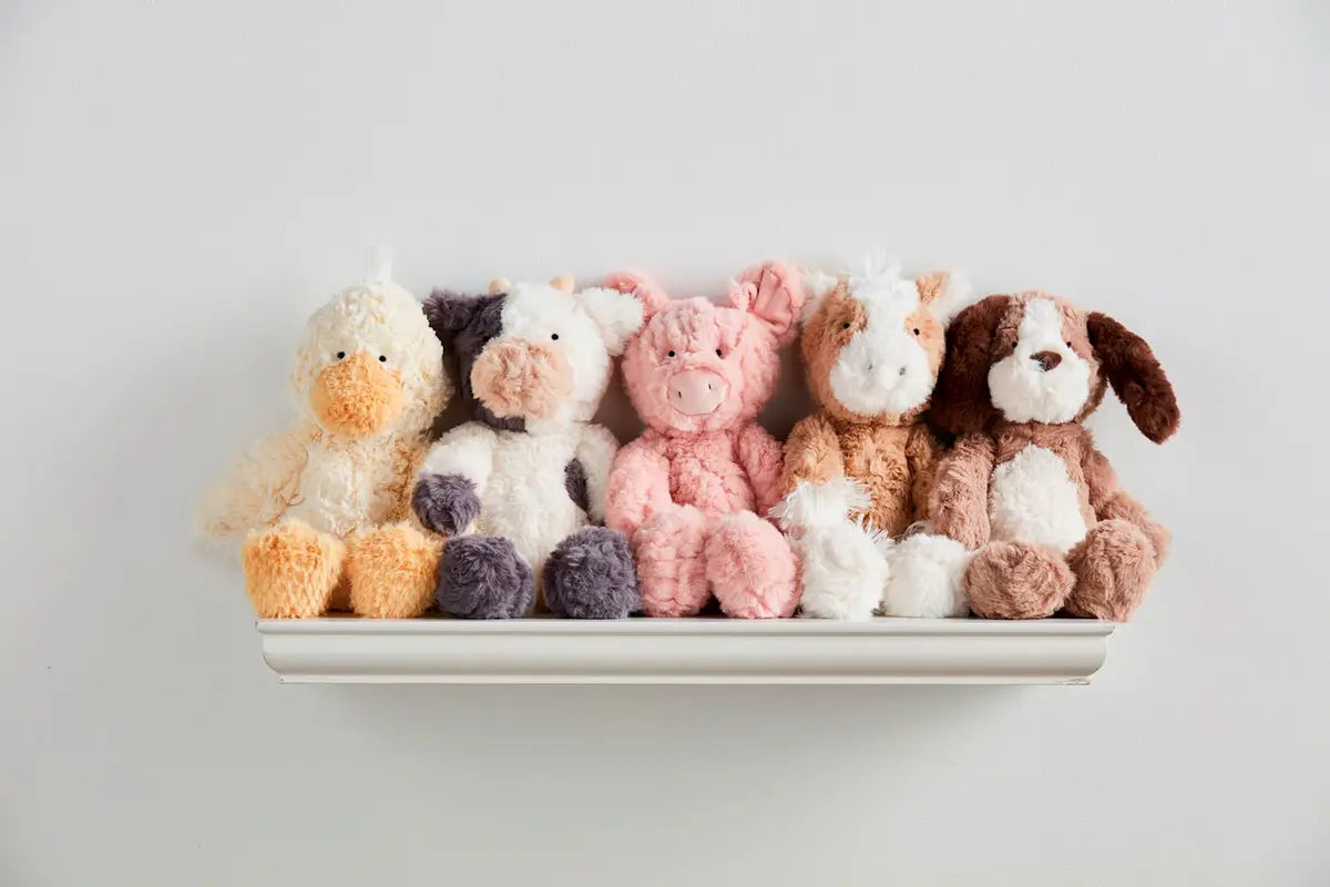 assorted Farm Plush Animals sitting on a shelf