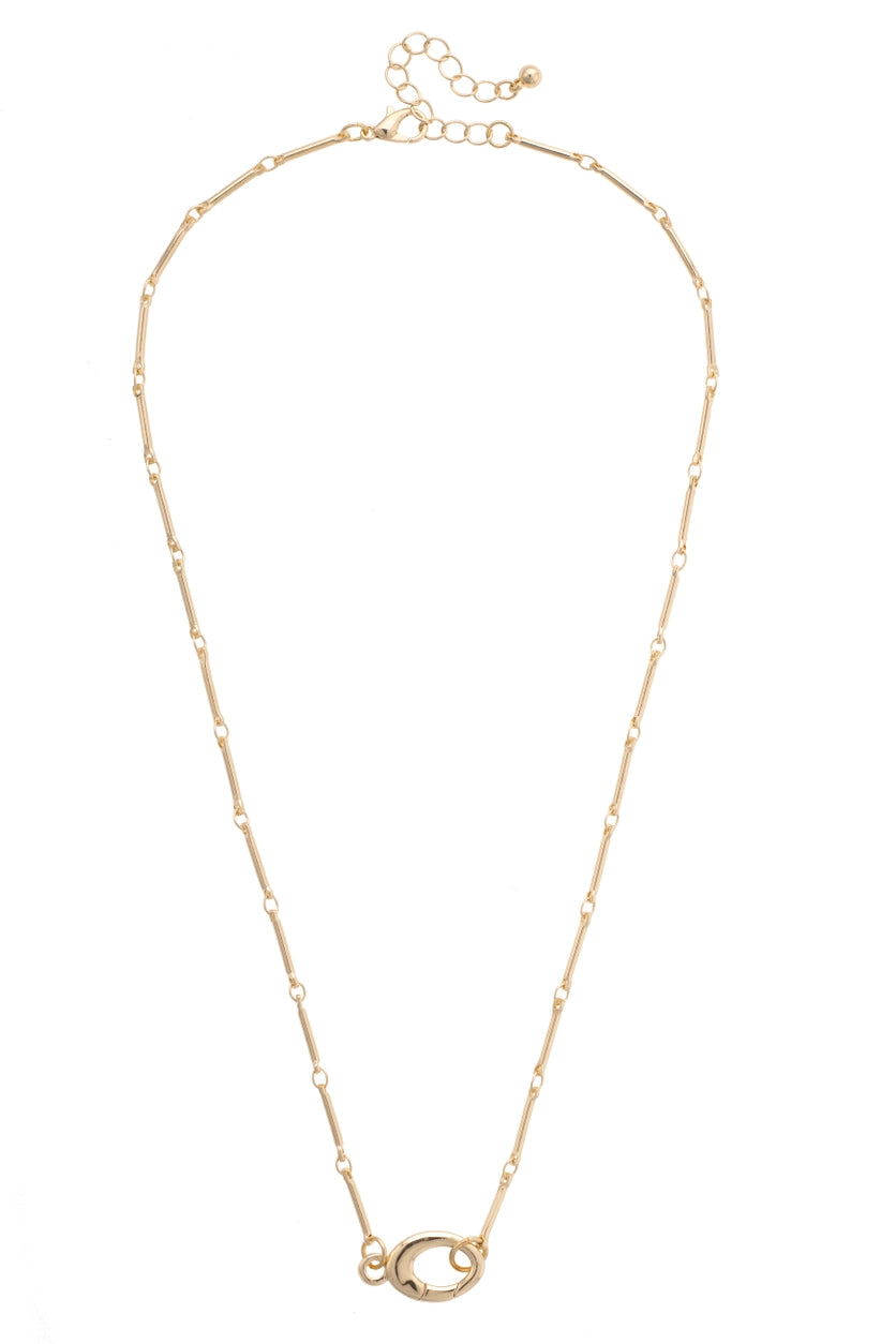 Gold necklace with front clasp for add charms in the front shown on a white background