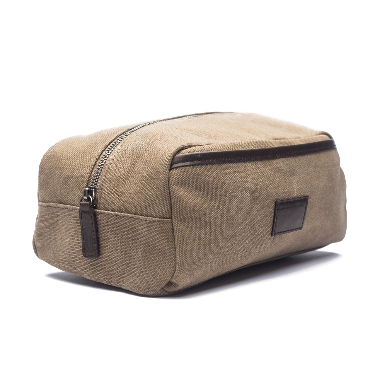 side view of khaki canvas zipper bag with vegan leather accents.