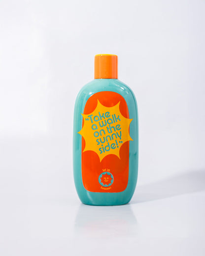 back view of sun block bottle vase with "take a walk on the sunny side" printed on it