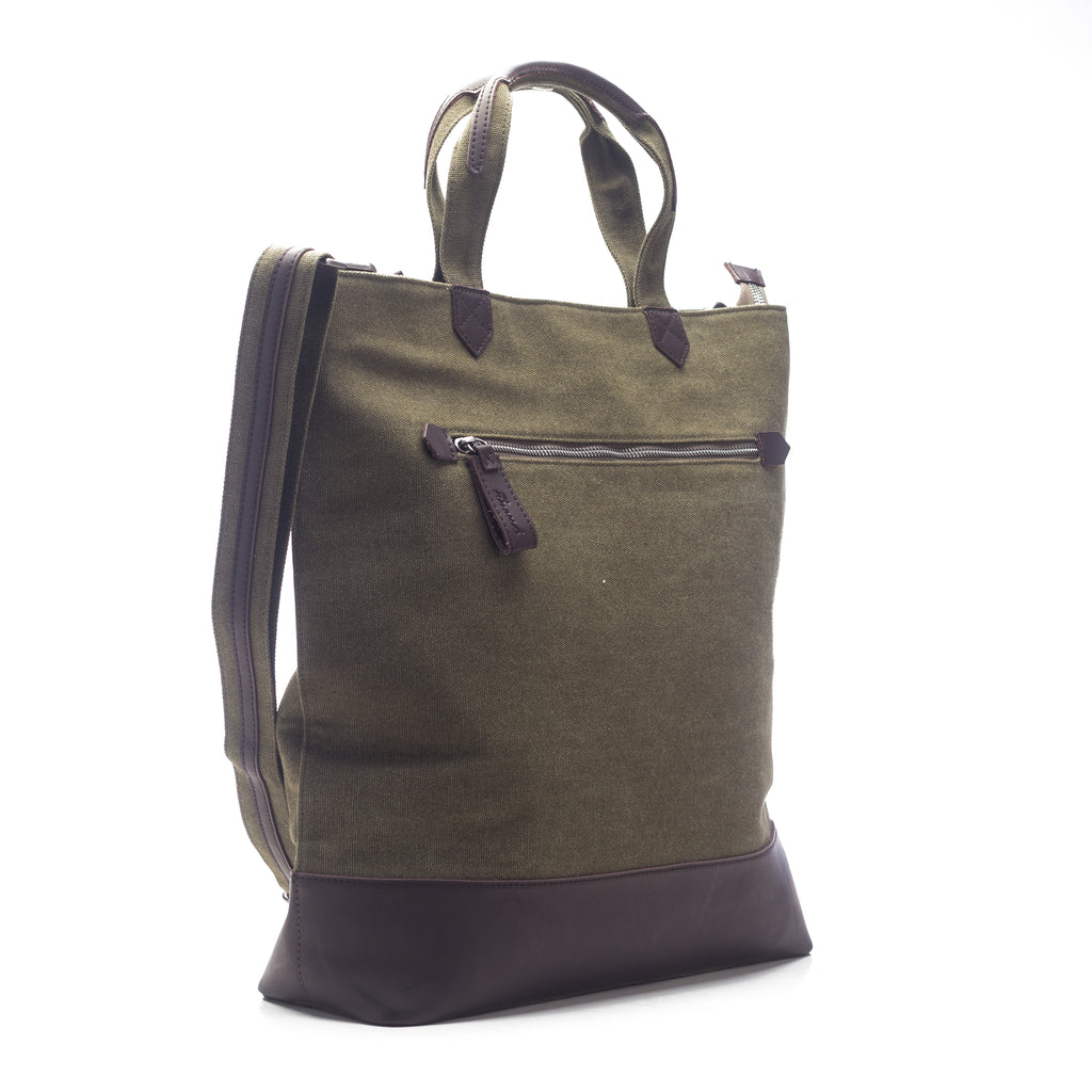 side view of green canvas tote with vegan leather accents.