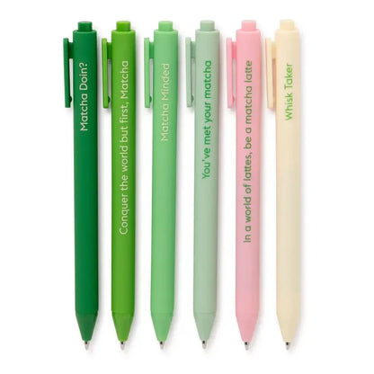 Set of colorful pens in green and pink hues with text on a white background