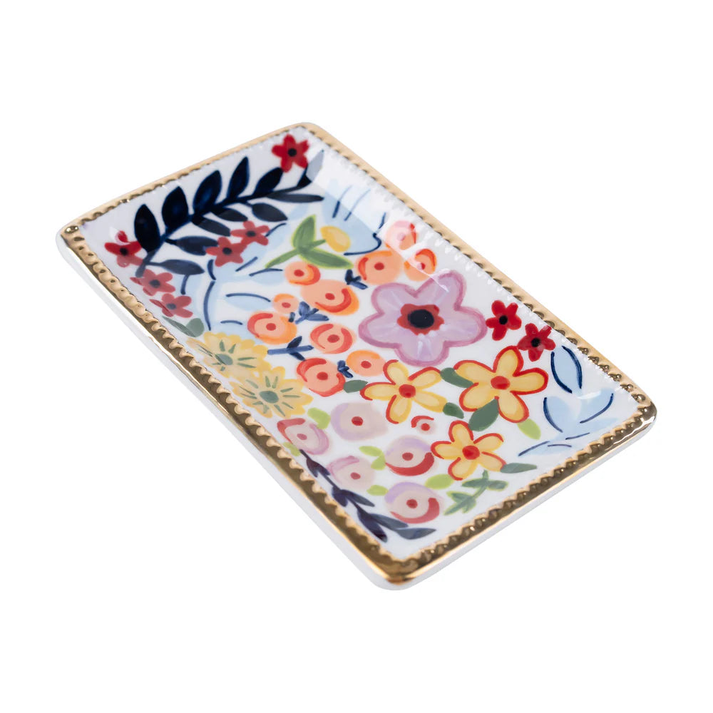 angled view of Rectangular ceramic tray with colorful floral design on a white background