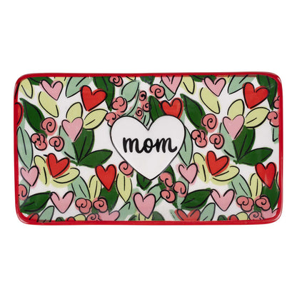Decorative tray with pink and red floral pattern and 'mom' heart design on a white background
