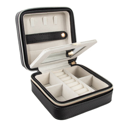 blacktravel jewelry box open showing two layers with slots and compartments of various sizes.