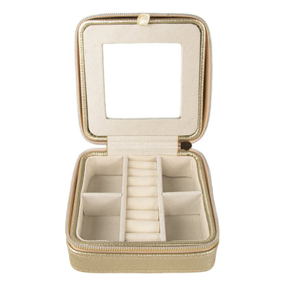 gold travel jewelry box open showing bottom section and built-in mirror.
