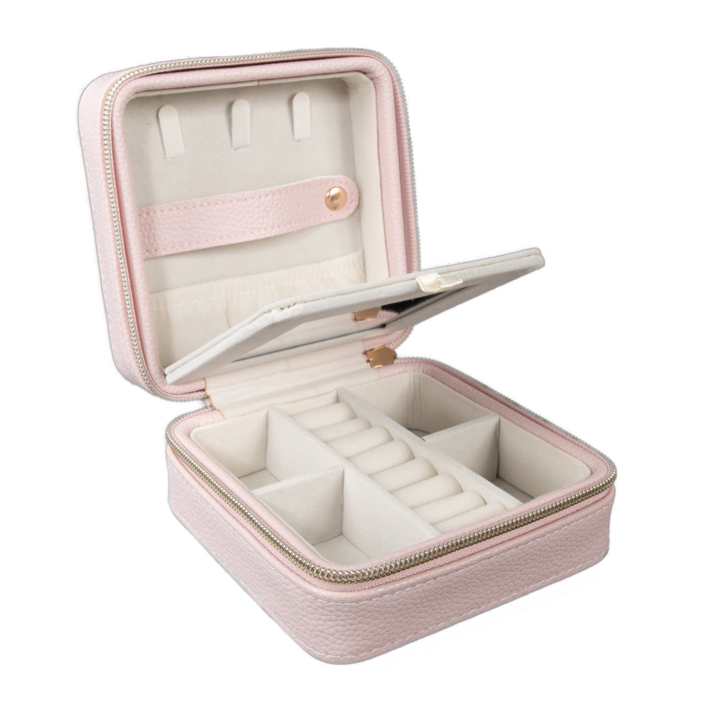 pink travel jewelry box open showing two layers with slots and compartments of various sizes.