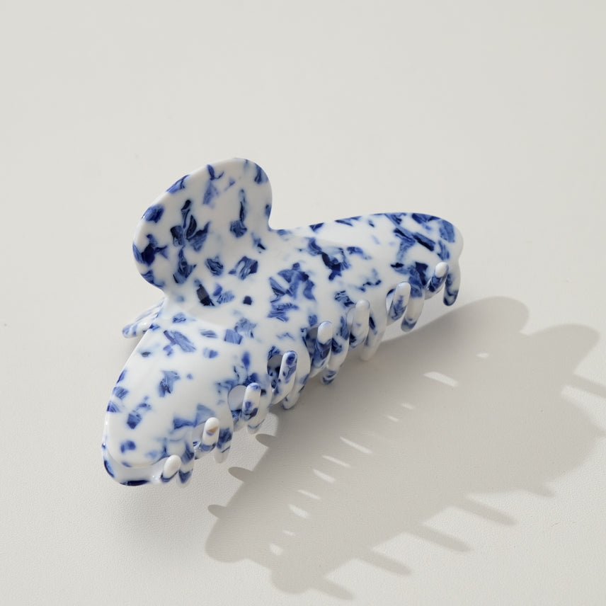 claw clip with bright blue and white marbled pattern