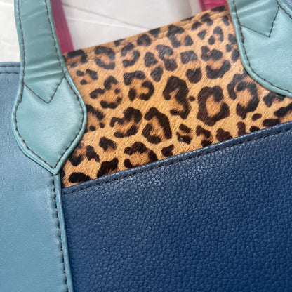 close-up of blue side of Peacock & Cranberry giselle tote