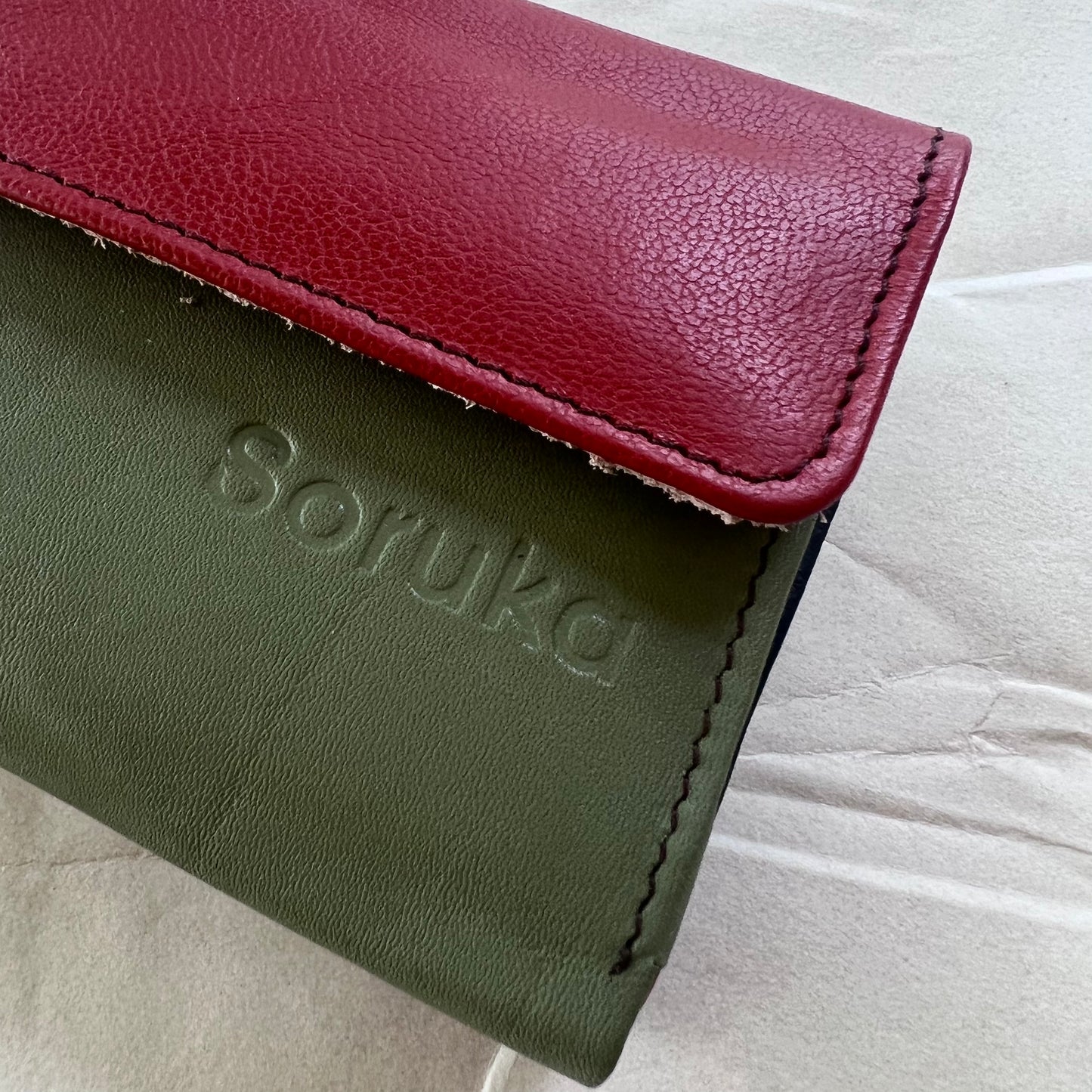 close-up of olive rings wallet