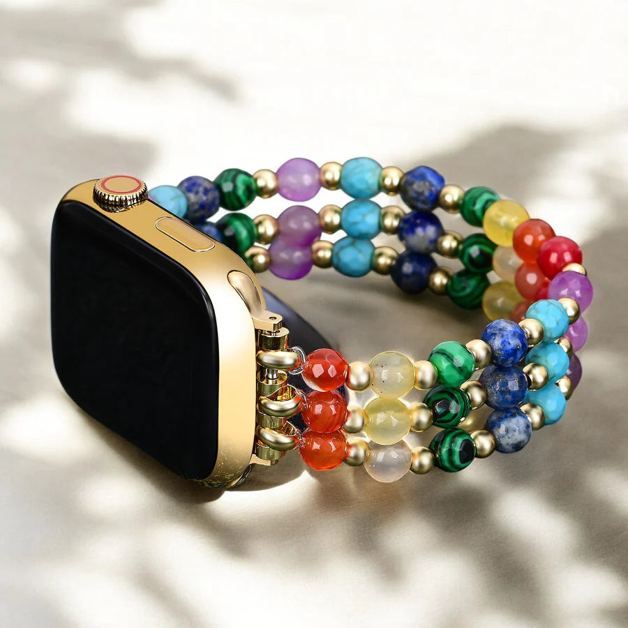 Smartwatch with a rainbow gemstone beaded band on a light background