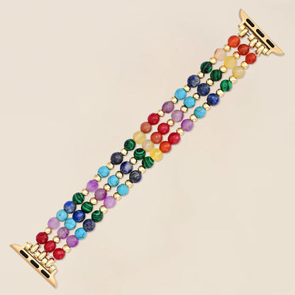 rainbow gemstone beaded watchband laying flat on a light background