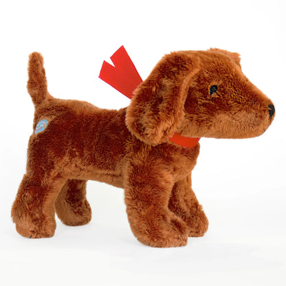 side view of Genevieve the Dog on a white background