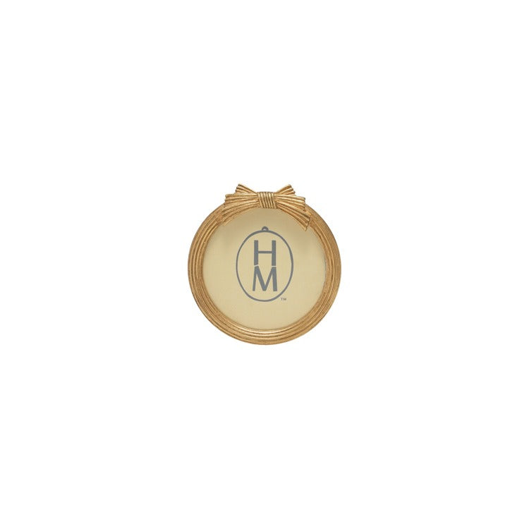 round gold frame with bow design on top