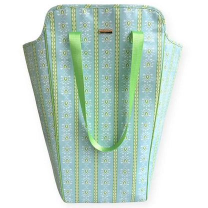 Tote bag with green straps and a patterned design on a white background