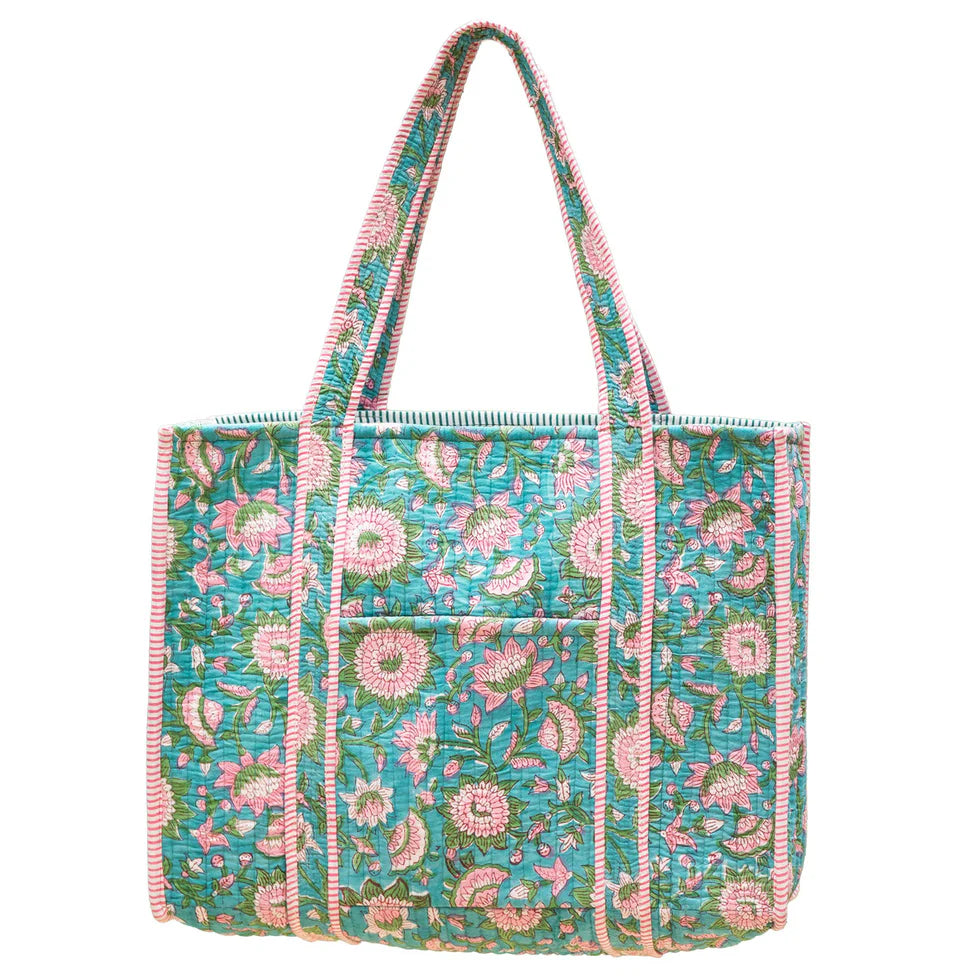 Floral patterned tote bag with pink and green accents shown on a white background