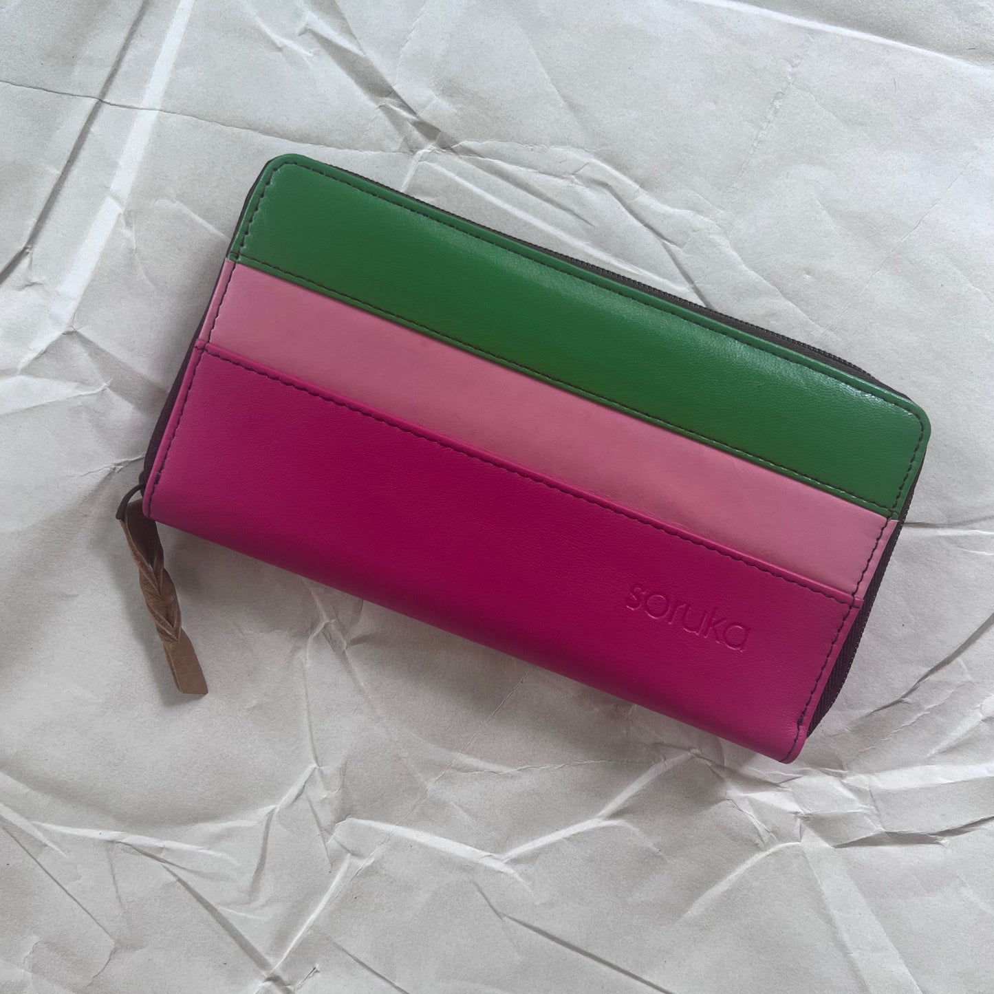 front view of pink carla wallet with pink and green stripes