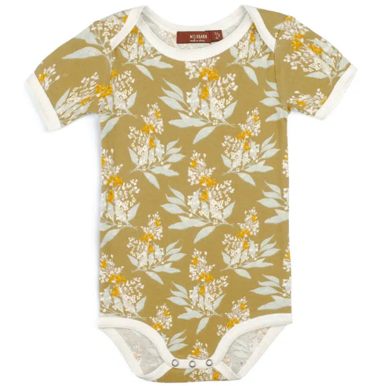 golden floral onsie on a white background.