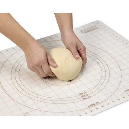 Person kneading dough on a Pastry Mat with measurements.