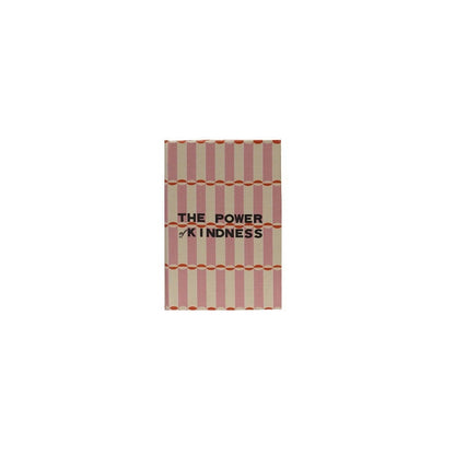A rectangular book box with a pink and cream striped cover, featuring the text 'THE POWER OF KINDNESS' in black. 