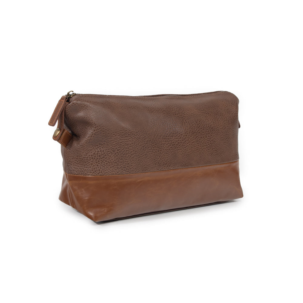 angled view of brown zippered toiletry bag.