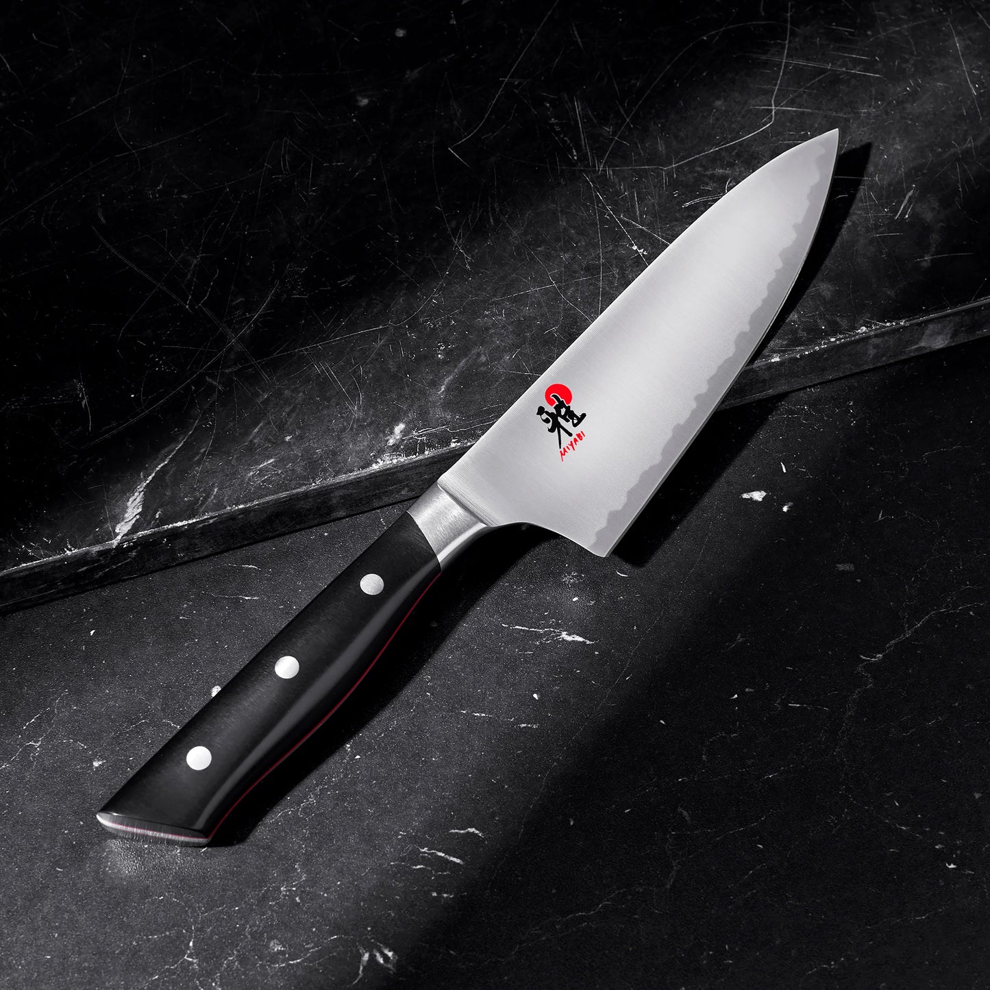6 inch Chef's Knife displayed on a black marble surface