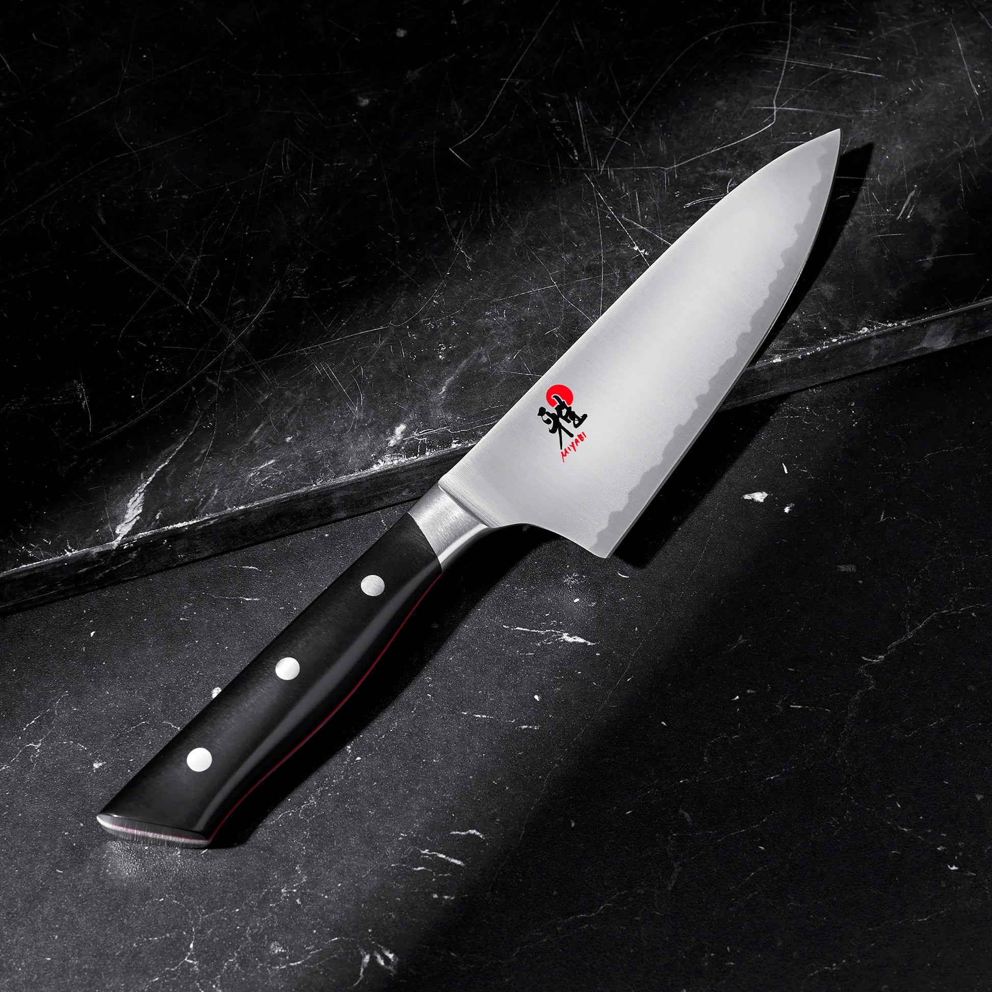 6 inch Chef's Knife displayed on a black marble surface