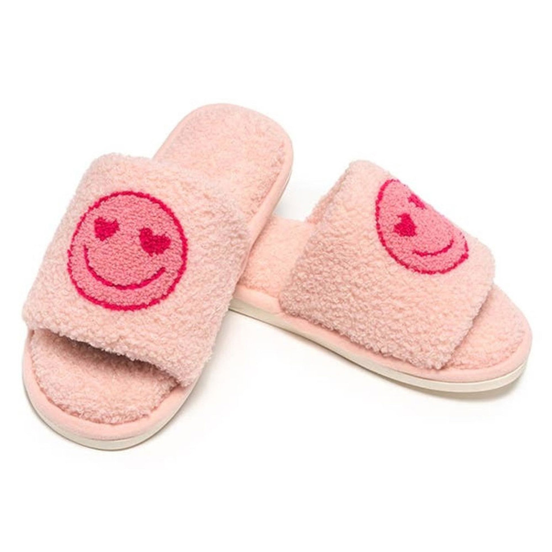 pink slipper slides with heart eyes smiley face on them.