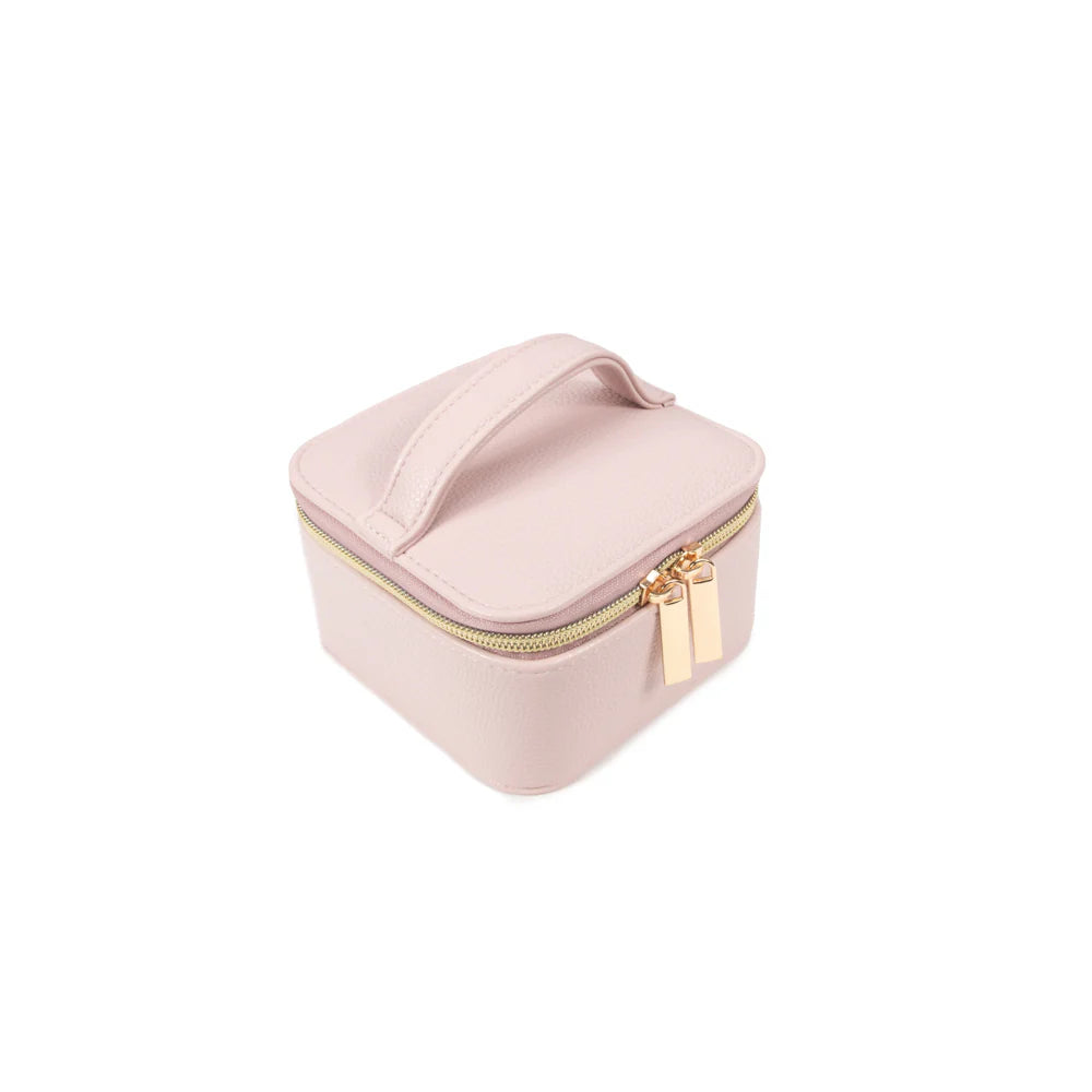 angled view of the Leah Travel Jewelry Case with Pouch in pale pink zipped closed
